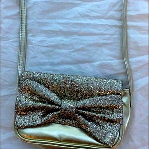 est. 1989 PLACE. Gold sparky purse. The sparkles don’t come off. Good condition.